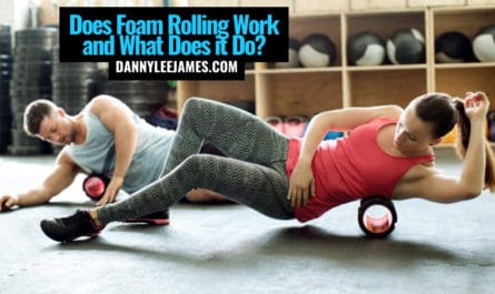 Fit man and woman foam rolling