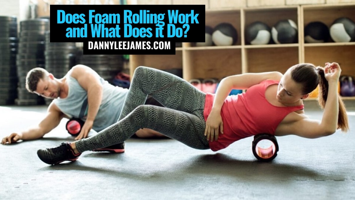 Fit man and woman foam rolling