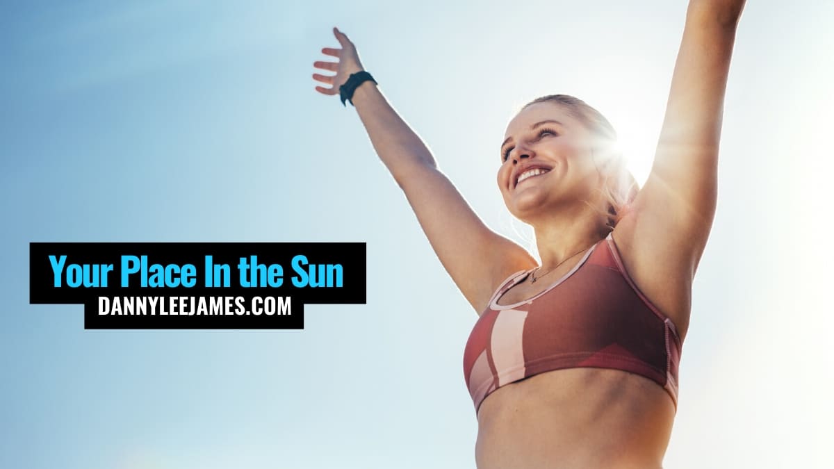Fitness woman celebrating success in the sun